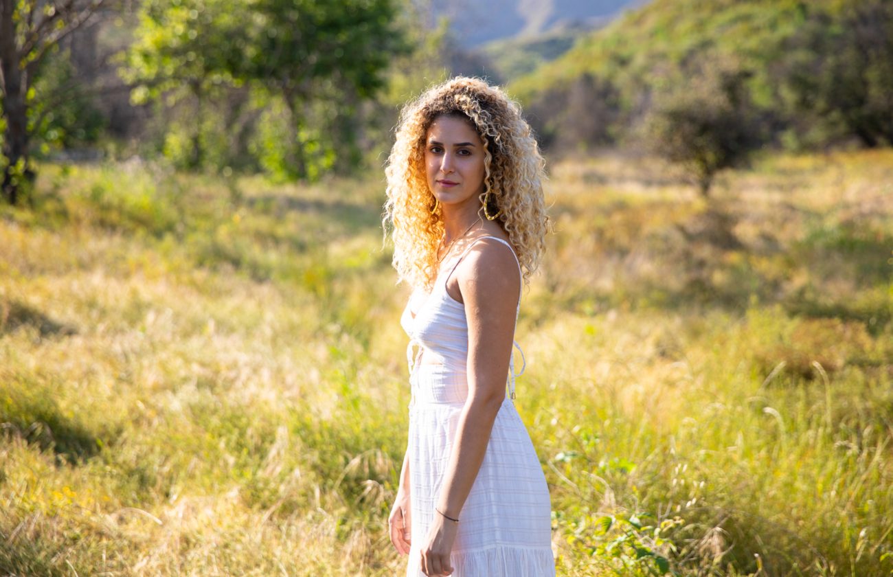 Roni by the water at golden hour
